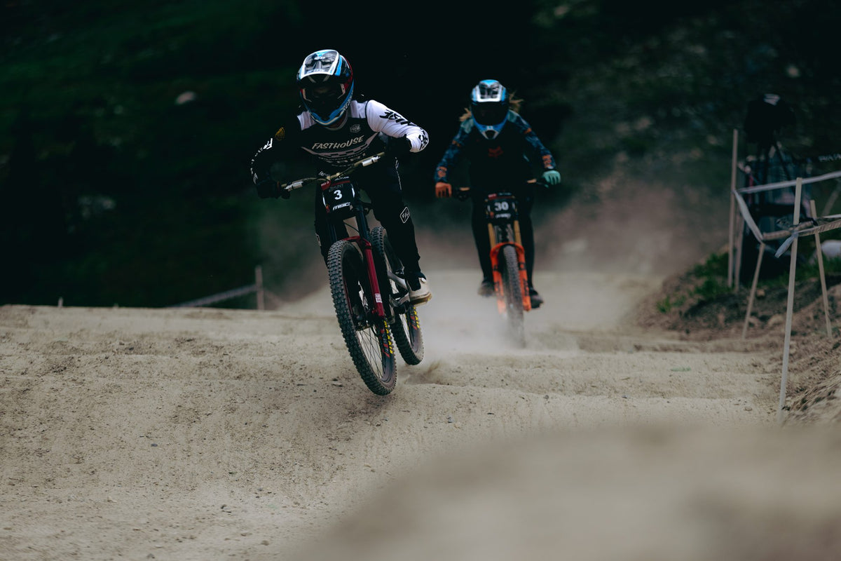 Two riders side by side in the dust at Solitude