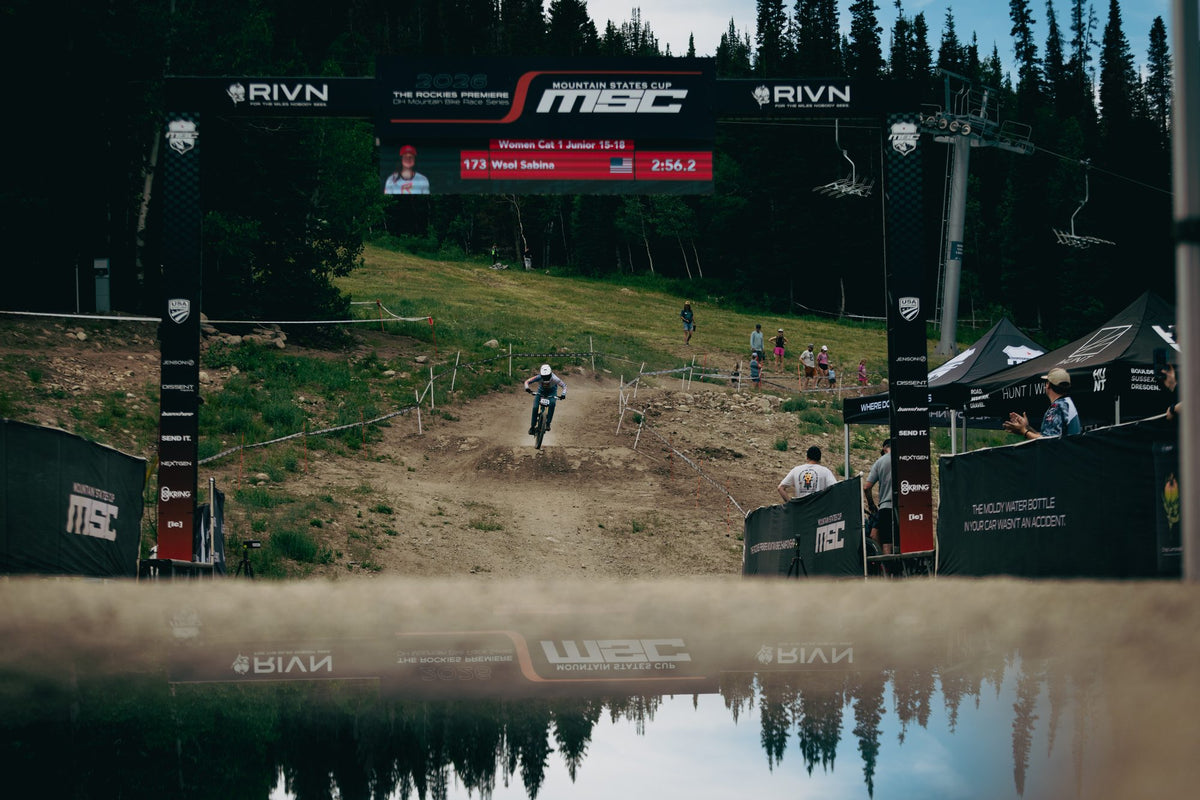 The finish arch at Solitude, mirrored in the pond