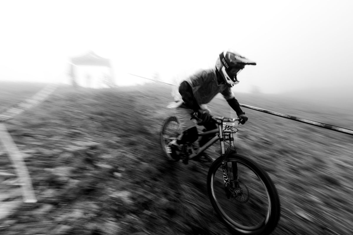 A rider comes out of the fog at Grand Targhee, in black and white